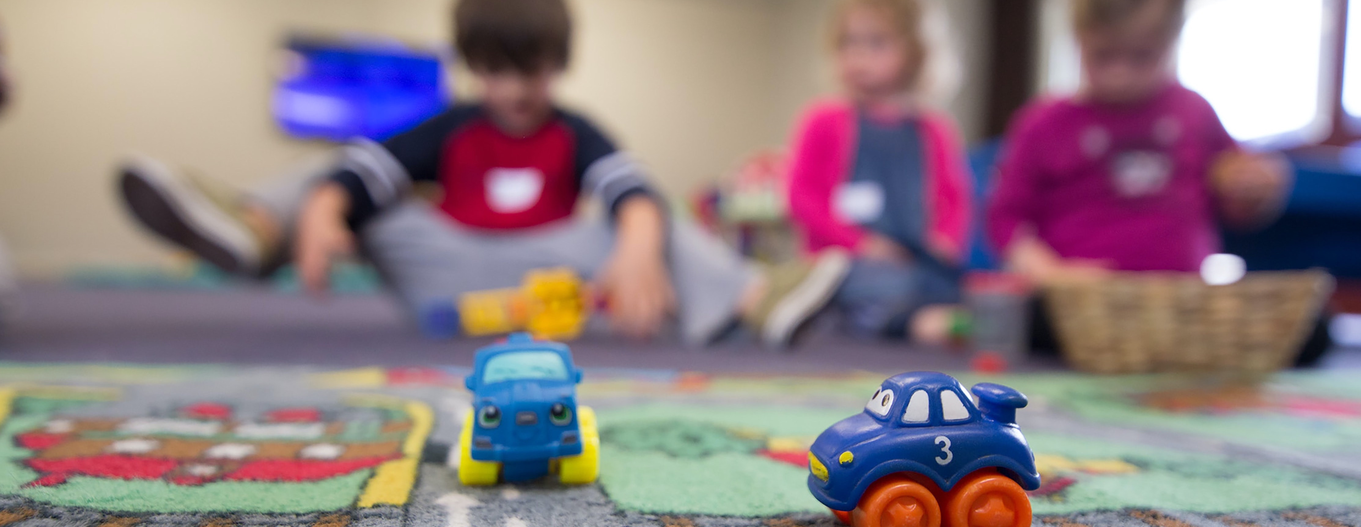 kids playing with toy cars