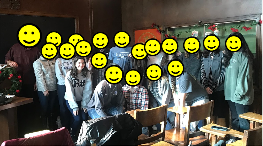 Picture of my service learning class with smiley faces over everyone's face but mine